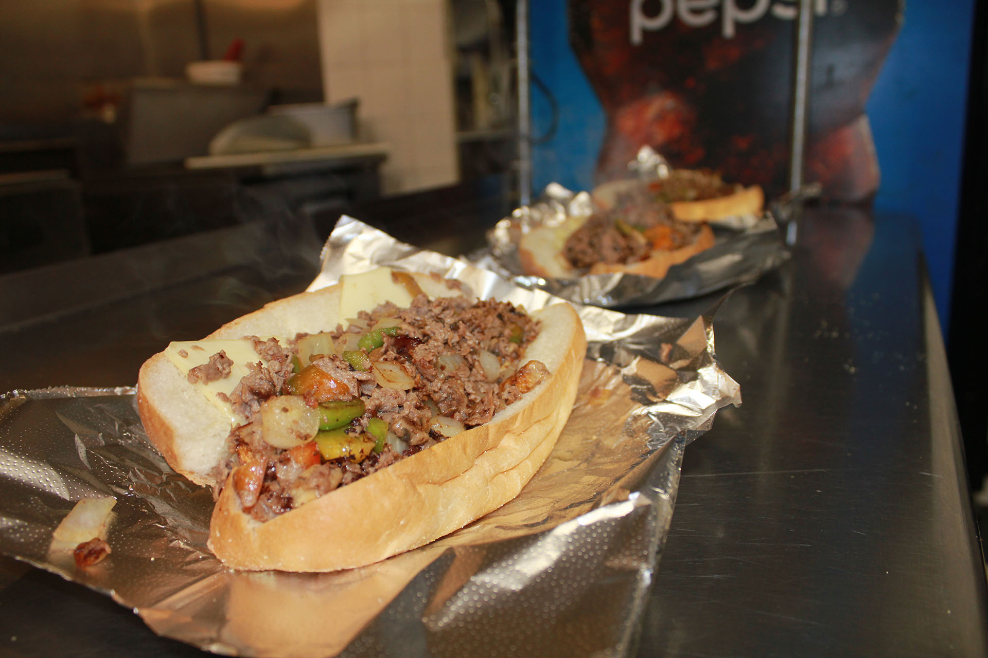 Steak and Cheese Subs with Peppers and Onions