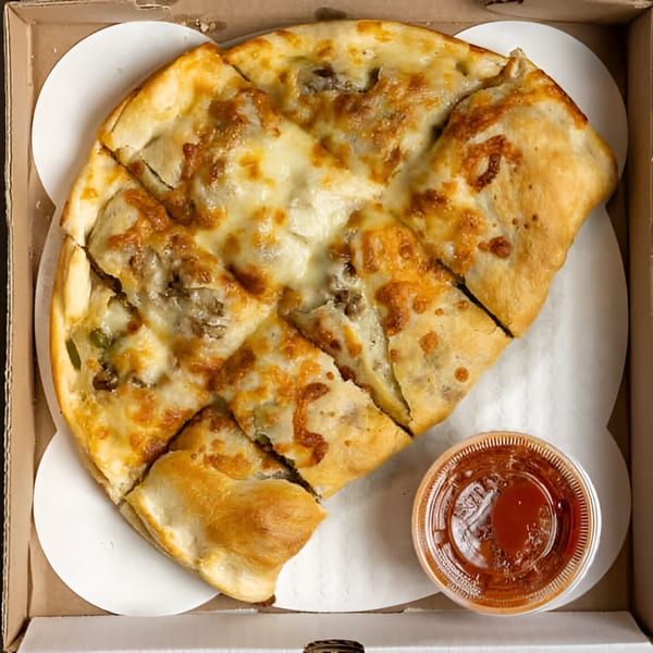 Angelina's Pizza's cheesy garlic bread, cut into squares, with a side of marinara sauce in a pizza box.